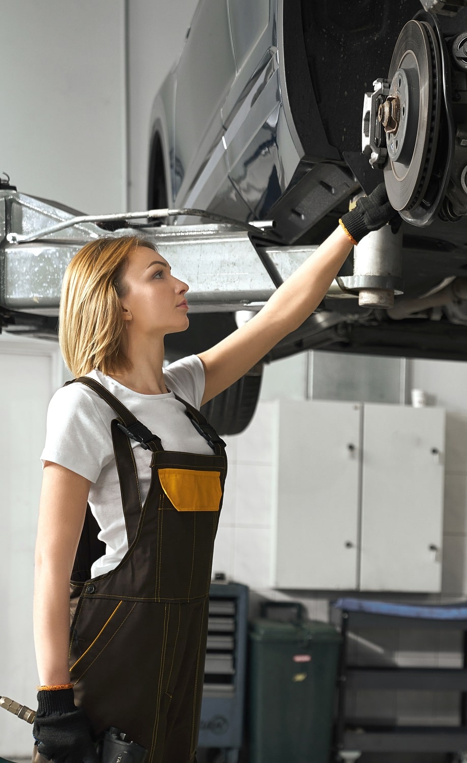 woman-looking-at-tire-of-car-in-auto-service-2021-08-30-09-55-39-utc-min.jpg